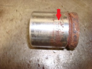 Note the pitted surface on the once smooth caliper piston surface.