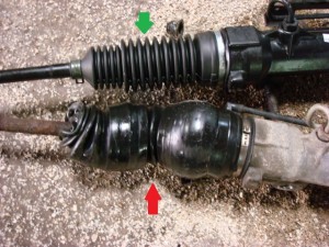 Old leaking power steering rack on the bottom indicated by red arrow. New power steering rack on top indicated by green arrow